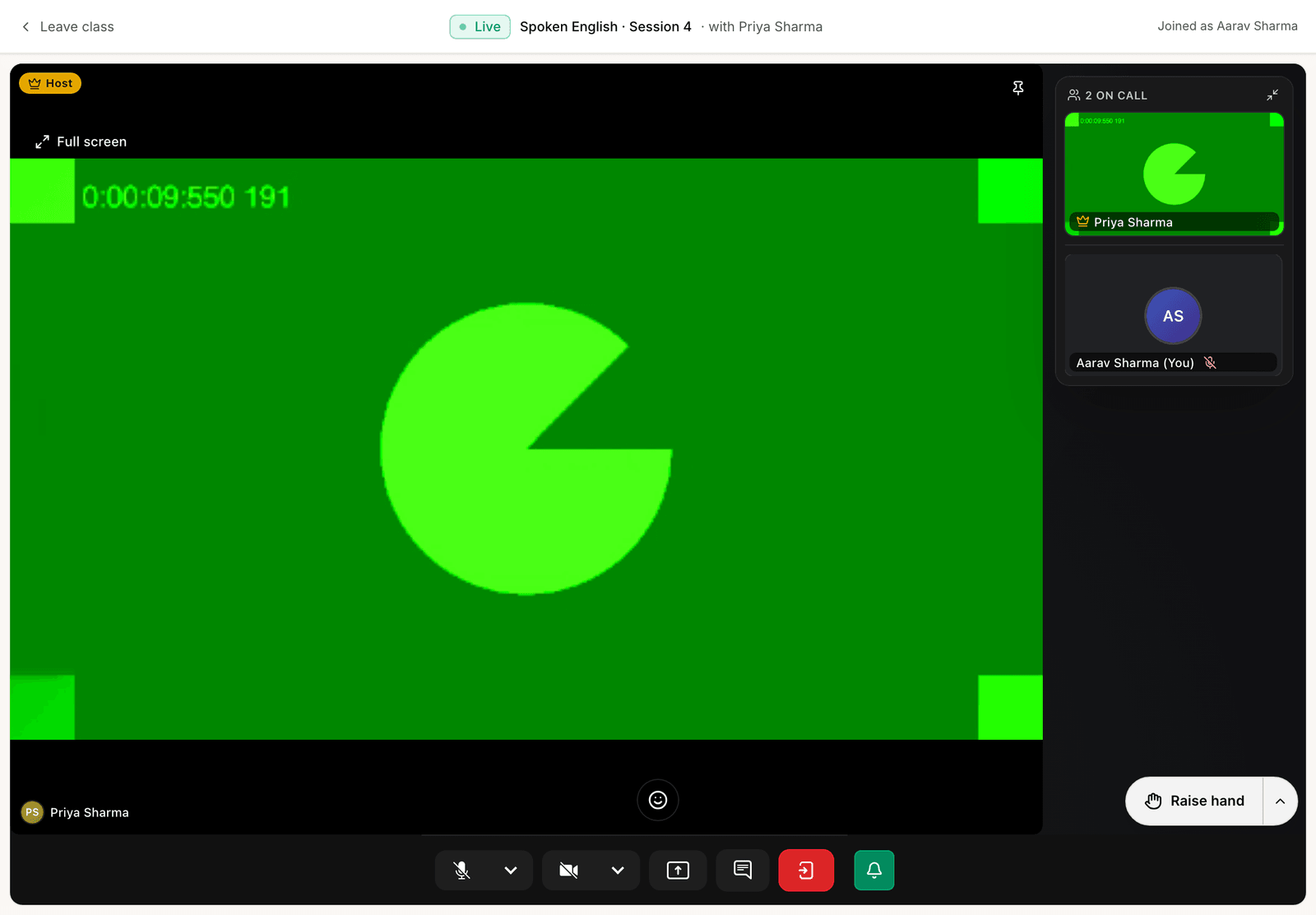 Inside a live class, showing the teacher's shared screen with the class controls along the bottom including microphone and camera buttons and a Raise hand button.